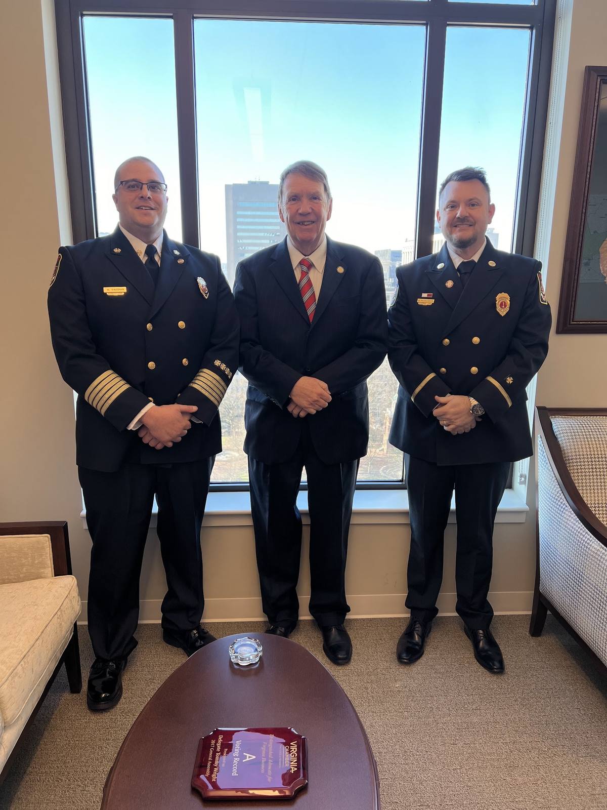 Derek Hazelwood with two South Hill Volunteer Fire Department officers in dress uniform