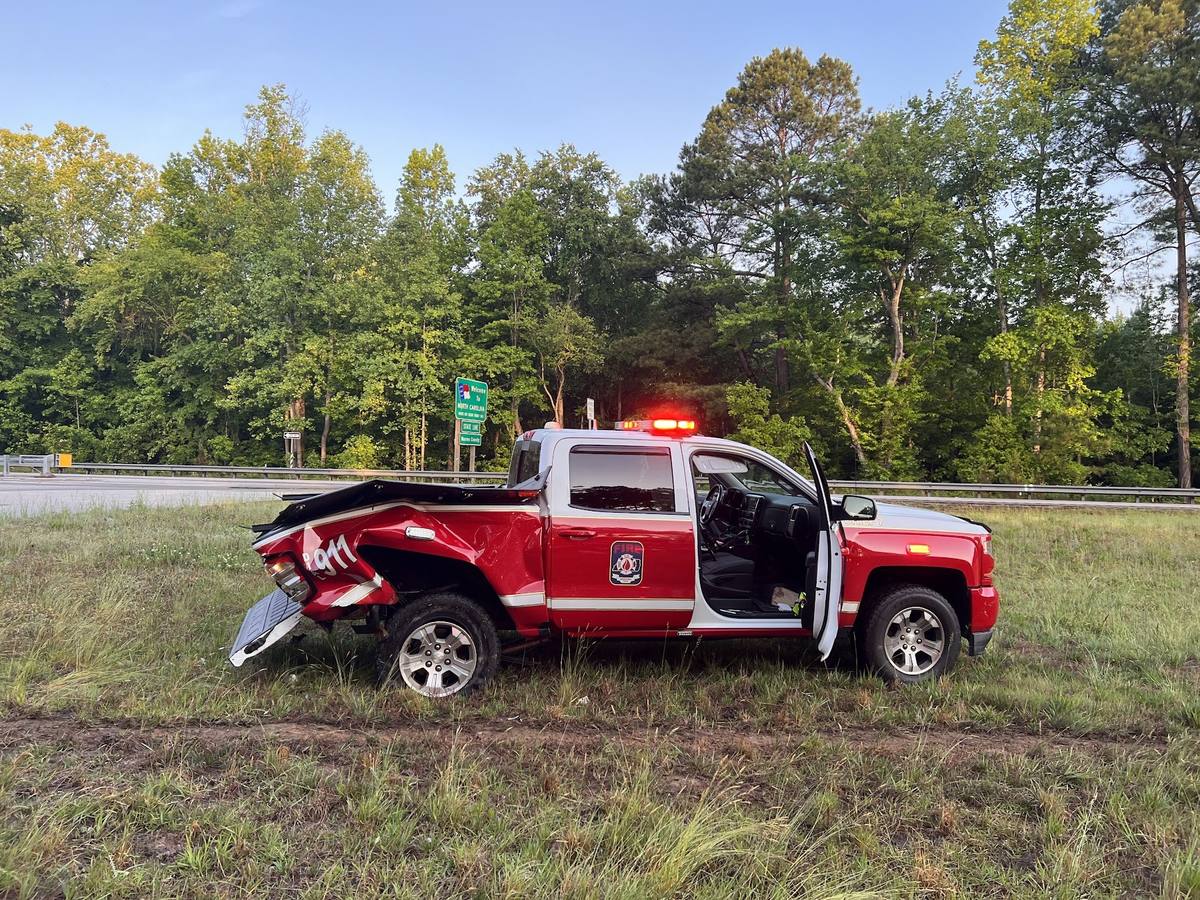 The South Hill fire department command truck off the roadway after being struck at a crash scene