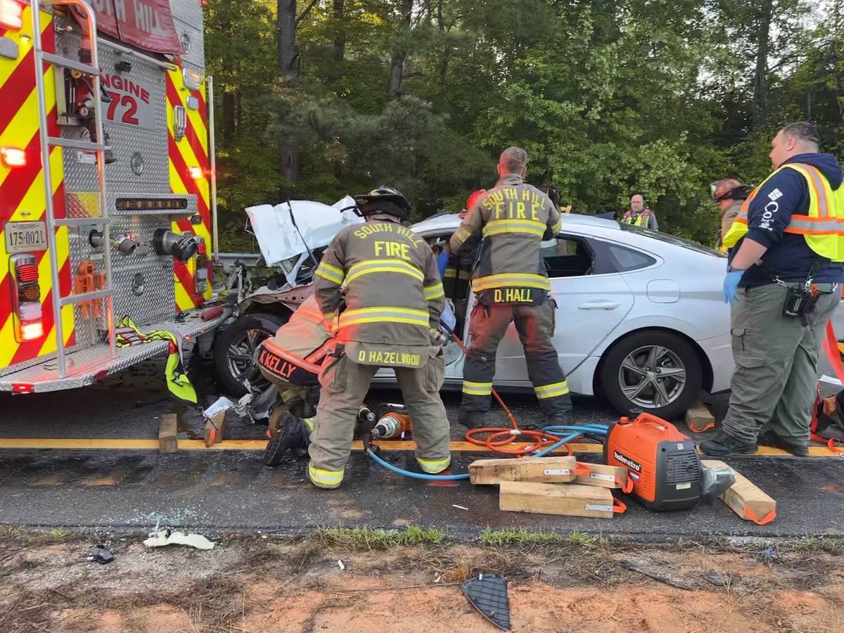 Firefighters and deputies working an extrication on Interstate 85, South Hill Virginia