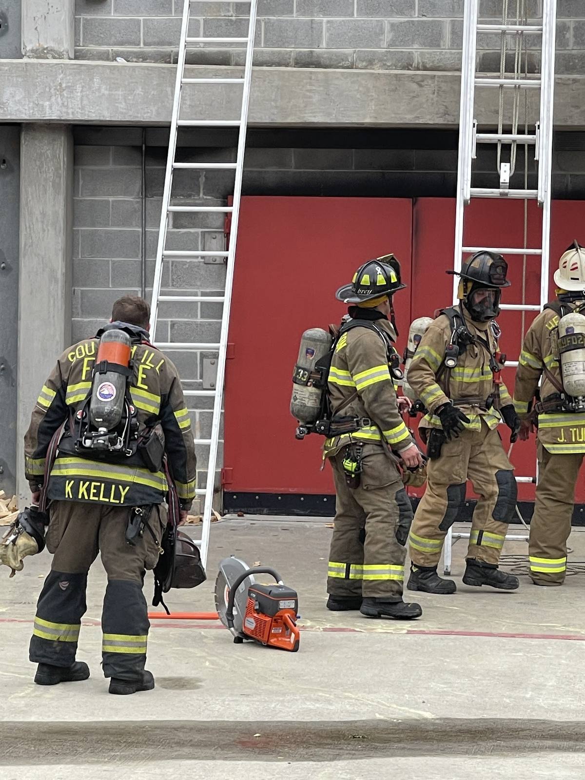 South Hill crew staging ladders and saws at the training tower
