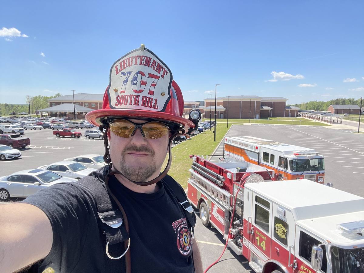 Lieutenant Derek Hazelwood with apparatus staged at a school, South Hill Virginia