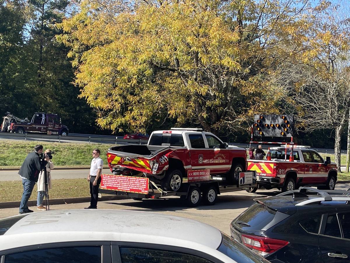 News crew filming the Move Over Law display truck at a South Hill awareness event