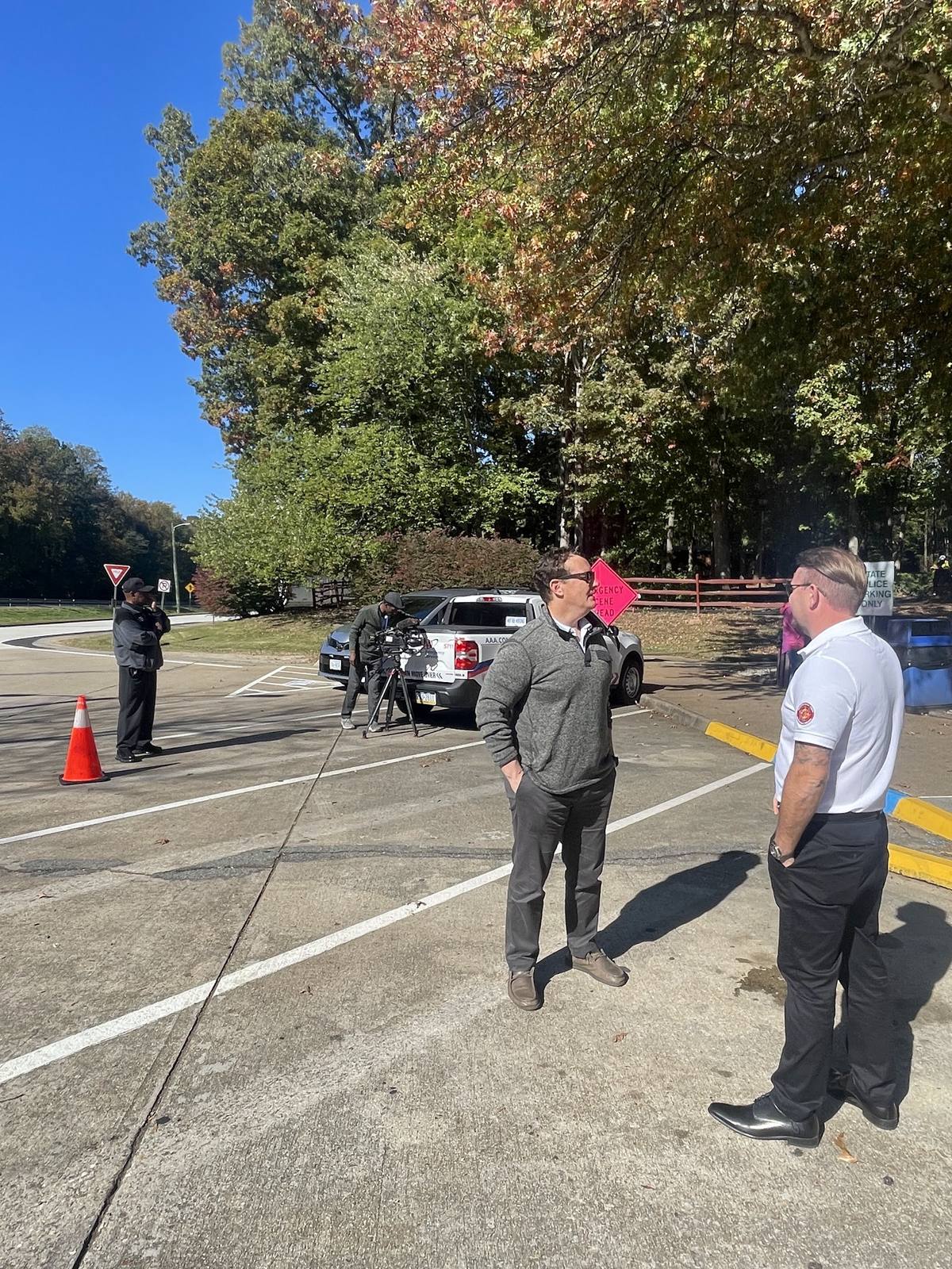 Derek Hazelwood speaking with an attendee at a Move Over Law awareness event