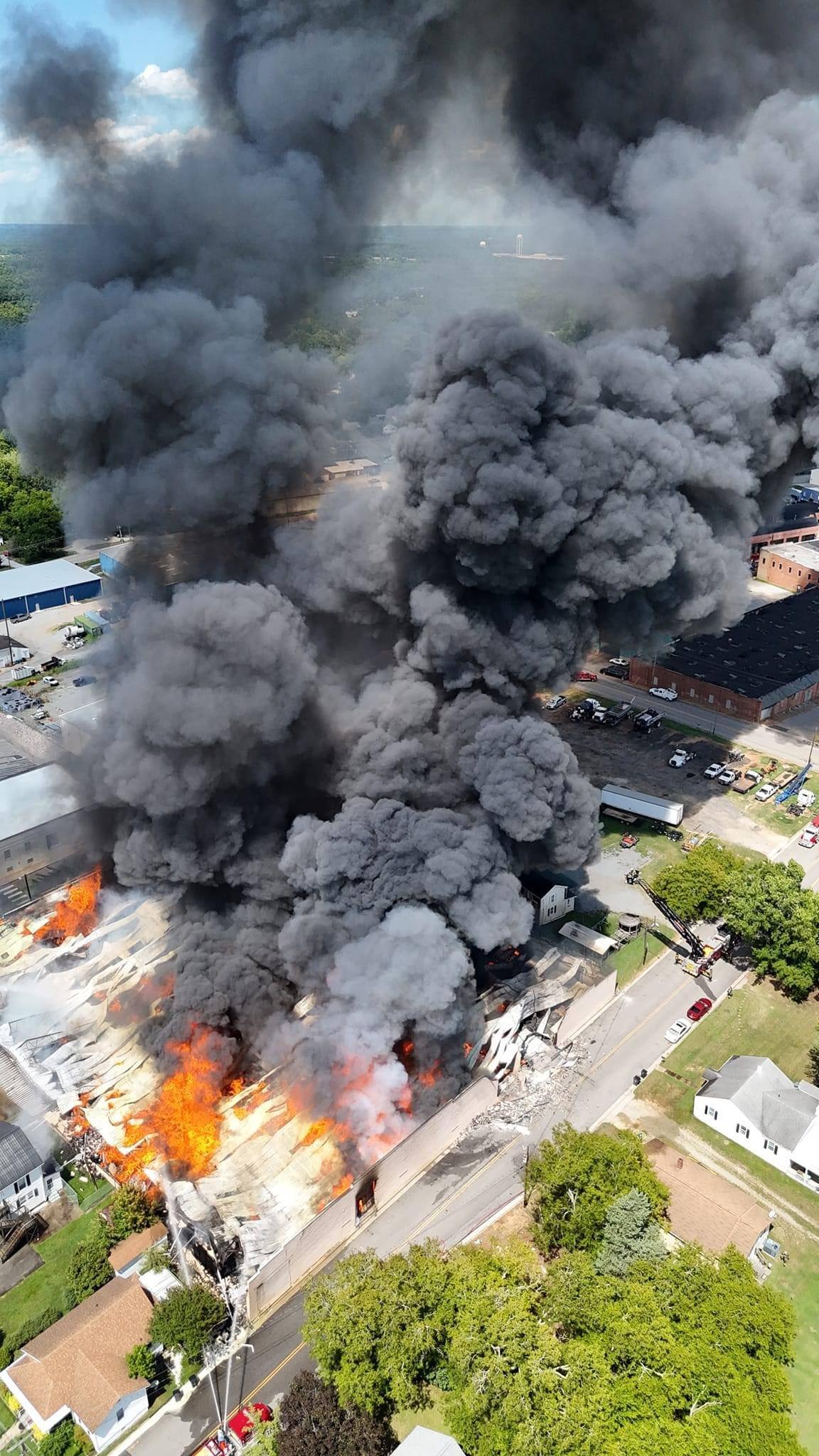 Smoke column over a commercial building fire seen from directly above