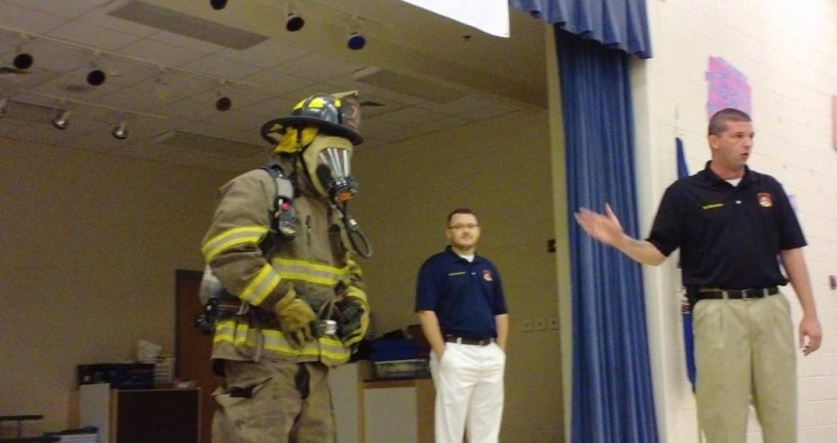 Turnout gear and air pack demonstration during a classroom session