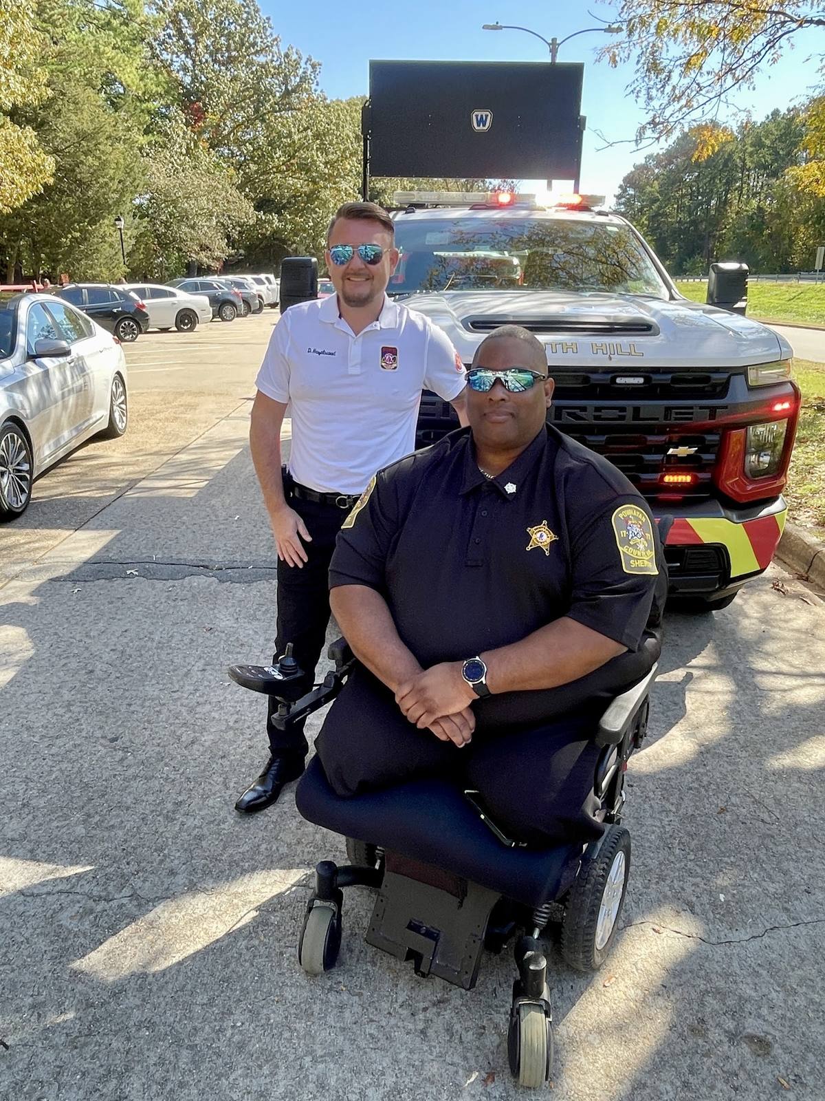Derek Hazelwood with Deputy Brad Hughes, Powhatan County Sheriff's Office, highway safety awareness, South Hill Virginia