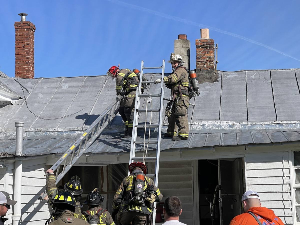 Roof ladder operation and ventilation work at a house fire, South Hill Volunteer Fire Department