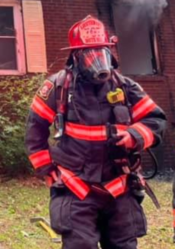 Derek Hazelwood in full turnout gear and mask at a working structure fire in South Hill, Virginia